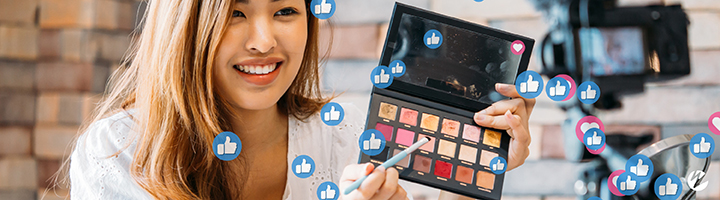 Social media live stream with influencer demoing makeup.