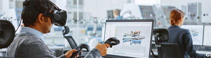 A man in an office setting wearing a virtual reality (VR) headset to design a computer-aided drawing.