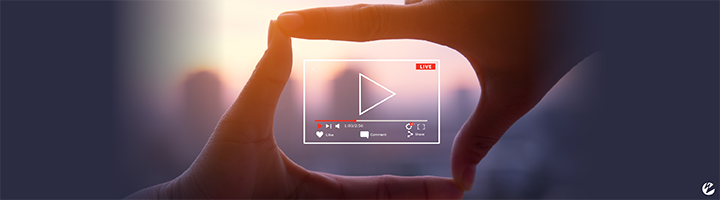 Two hands pressed together to make a square with a video playback graphic inside. 