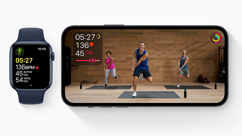Apple watch and iPhone with live fitness class and health metrics such as calories, time, and heart rate. 