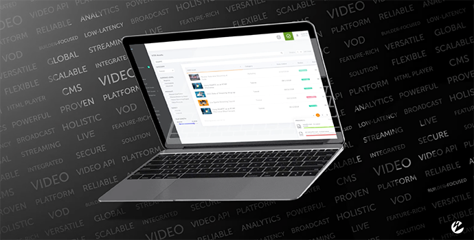 A laptop with Wowza's new integrated video platform on the screen before a black background with text.